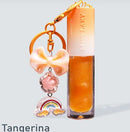 Lip Gloss Tangerina com Chaveiro Miss Lary - Brilho Espelhado, Hidratação e Aroma Frutal